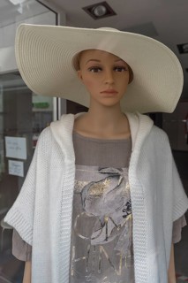 Female mannequin with large straw hat