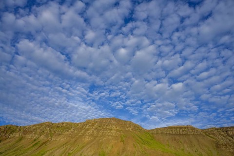 Sheep clouds and mountains in the evening light