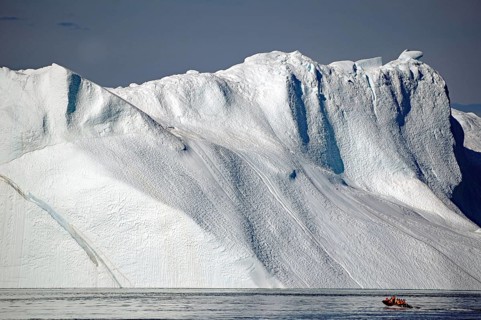 View of small boat in front of ice front