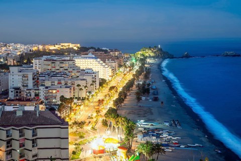 Panorama of touristic illuminated coast in Almunecar at night