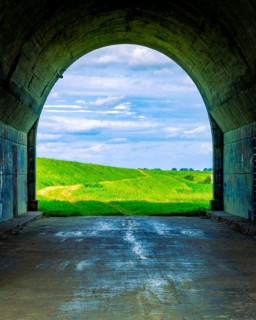 Tunnel and a view of the meadows. The tunnel under the 'Knybawa Bridge' over the Vistula River. Tczew