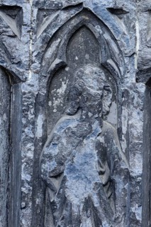 Old sculptures in need of renovation at the entrance gate to Notre-Dame Cathedral in Tournai