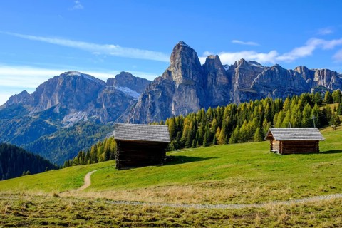 Mountain huts and sassongher from the Pralongia plateau
