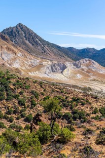 View into the caldera of colourful mineral deposits at the crater