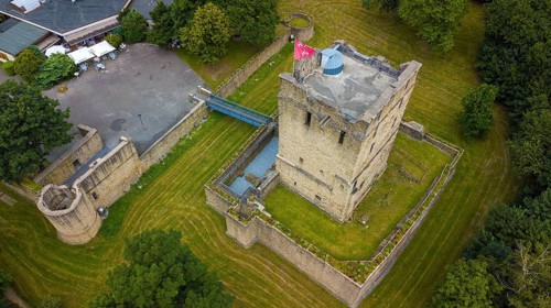 Fortified castle tower of ruin of partly reconstructed former moated castle Burg Altendorf from the Middle Ages