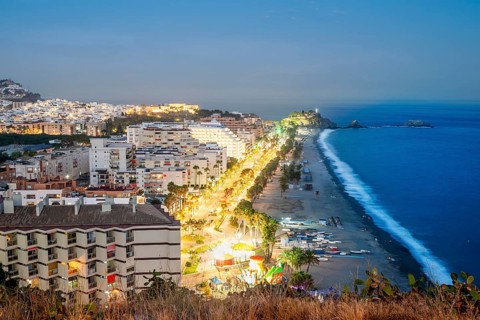 Panorama of touristic illuminated coast in Almunecar at night
