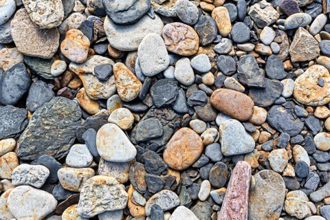 Various flat stones rounded by the sea