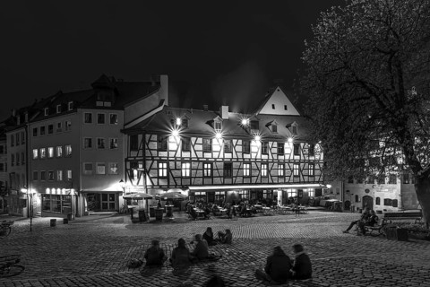 Historic inn in the old town with young people in the evening