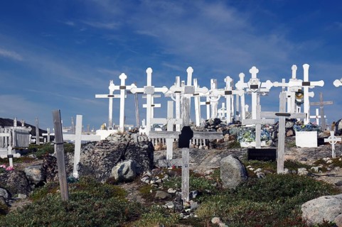 Wooden crosses in barren landscape