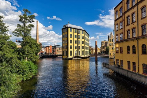 Former factory building Styrkjaern on the island of Laxholmen in the Motala stroem river