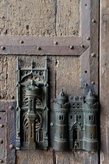 Door knocker and door lock on the gate of the town hall in Mons