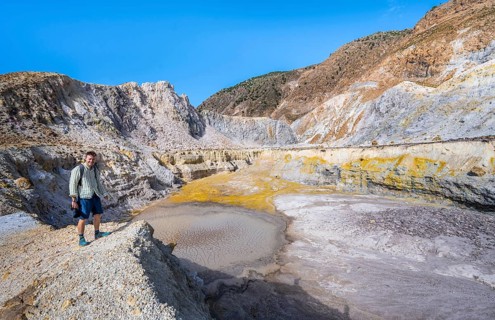 Young man at the crater rim