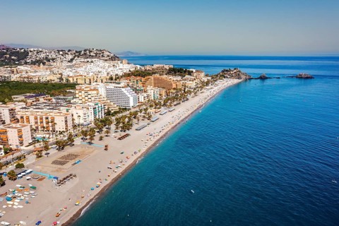 Aerial view of touristic coast in Almunecar by Mediterranean Sea