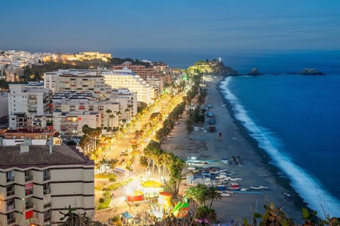 Panorama of touristic illuminated coast in Almunecar at night