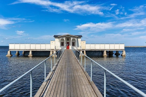 White cold bathhouse by the Baltic Sea