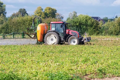 Farmer spraying pesticides