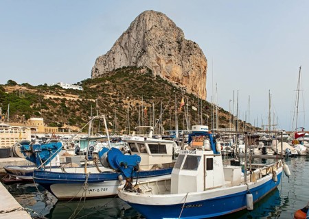 Boats and yachts at Calp (Calpe) harbor and Penyal d'Ifac rock