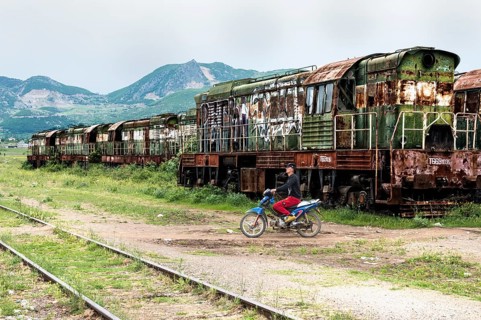Motorcyclist crossing railway tracks
