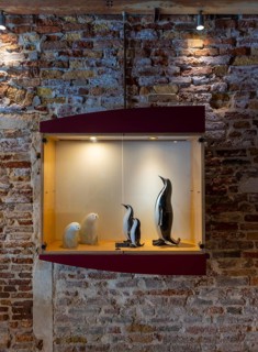 Display case with mouth-blown animal statues