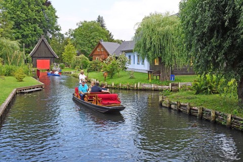 Tourists in Spreewald barges in the village of Lehde