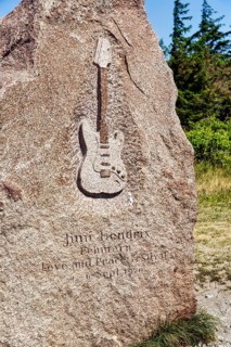 Memorial stone with inscription and relief of an electric guitar by Jimi Hendrix