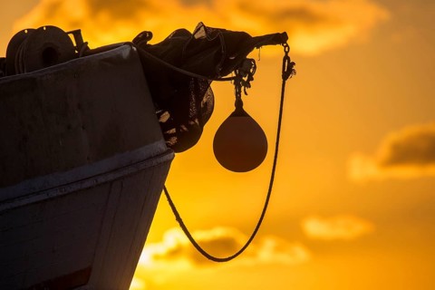 Fishing boat in sunset