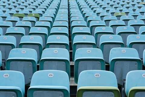 Blue and occasional green folding seats on the grandstand of the Seebuehne