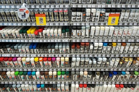 Paint and varnish spray cans in DIY store