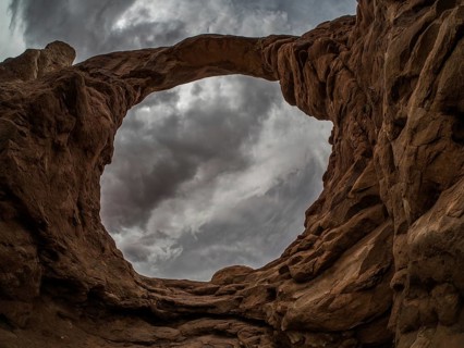 Thunderclouds over rock formations of the Windows Selection