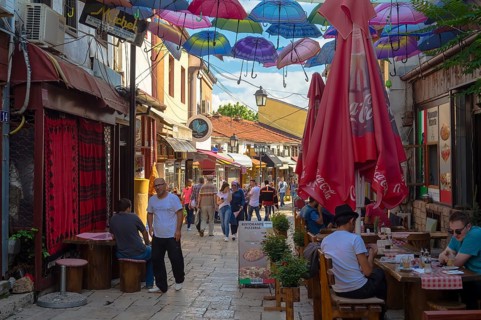 Colorful umbrellas hanging in a street
