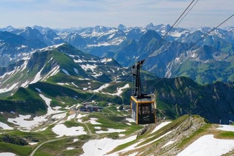 Gondola of the Nebelhornbahn and panoramic view of the Allgaeu Alps