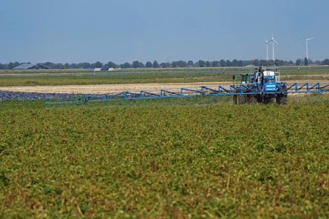 Farmer spraying pesticides