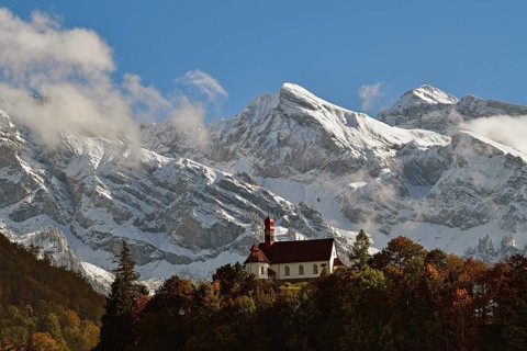 Flueeli Ranft Chapel in front of Alpine panorama