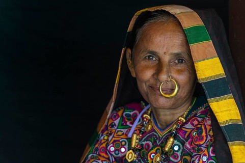 Elderly Ahir woman in traditional colorful cloth with a nose ring