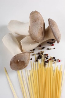 King trumpet mushrooms (Pleurotus eryngii) and peppercorns