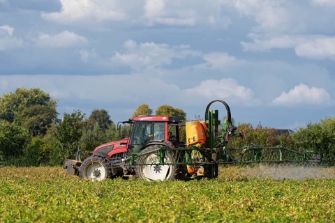 Farmer spraying pesticides