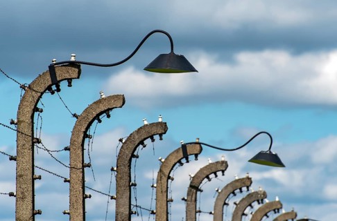 Barbed-wire fence and lampposts at Auschwitz II-Birkenau concentration camp