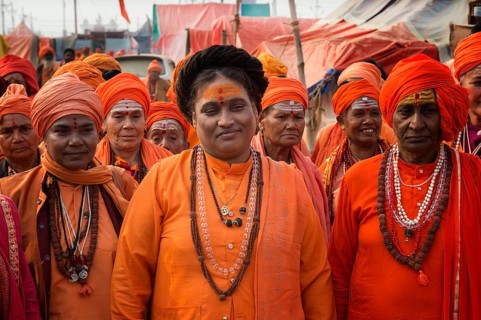 Sadhvi in orange and red saree during Allahabad Kumbh Mela