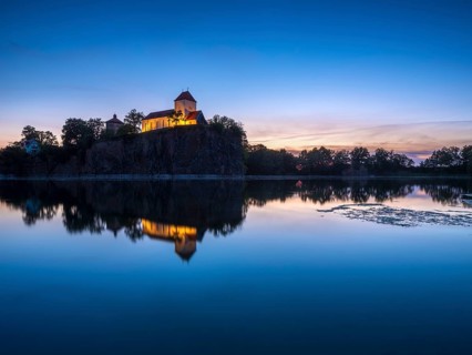 Kirchberg with mountain church and water tower at dusk