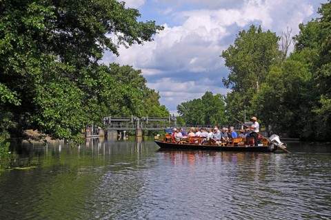Tourists in typical barges along the Spree