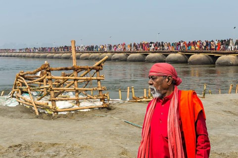 Pilgrims cross the Ganges on a makeshift pontoon bridge