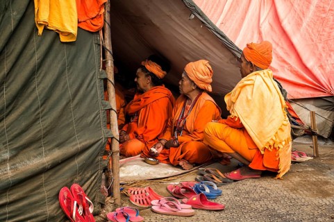 Sadhvi in orange and red saree during Allahabad Kumbh Mela