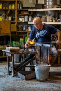 Master glassblower working hot glass
