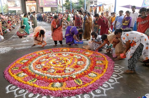Kolam and floral decoration in front of Kapaleeshvara temple during a festival