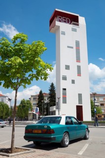 Mercedes taxi in front of Red Tower observation tower at Theatre Square