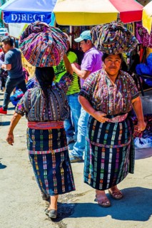 Market woman with wrap skirt and colourful embroidered blouse