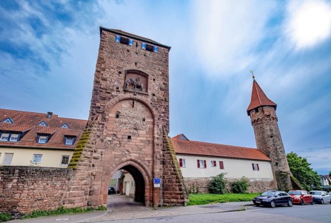 St. Martin's Gate with depiction of St. Martin sharing his coat on a horse and witch's tower
