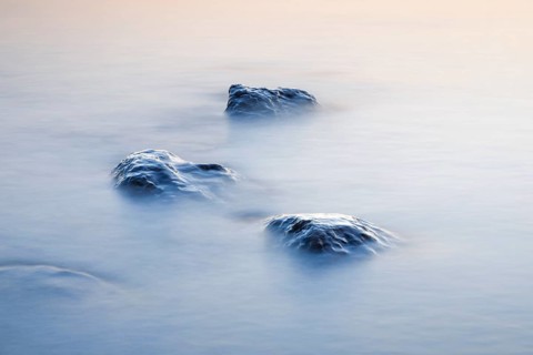 Stones in water photographed with slow shutter speed