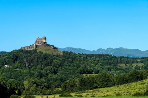 Castle of Murol and view on Sancy massif in Auvergne Volcanoes Natural Park