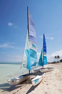 Sandy beach beach with two catamarans